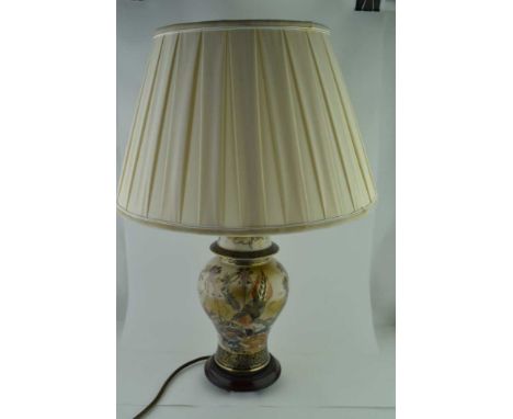 A POTTERY VASE FORM TABLE LAMP, wrythen form, moulded with two handles, floral decorated, the pottery vase stem 38cm high, fi