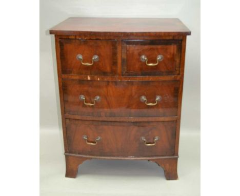 A LATE 19TH CENTURY MAHOGANY BOW FRONTED CHEST OF FOUR DRAWERS, having crossbanded top, over two crossbanded inline drawers, 