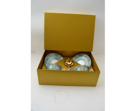 A "FORTNUM & MASON" TEA FOR TWO SET, original box containing two bone china cups & saucers, gilded blue butterfly & flower de