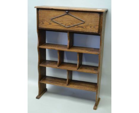 AN EDWARDIAN OAK BOOK SHELF UNIT with fold down top section, 64cm wide x 92cm high 