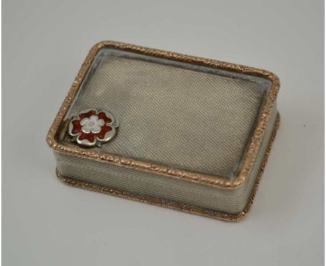 A 20TH CENTURY SILVER SNUFF BOX, Masonic interest, engine turned decoration, gilded edge, the hinged cover set with red ename