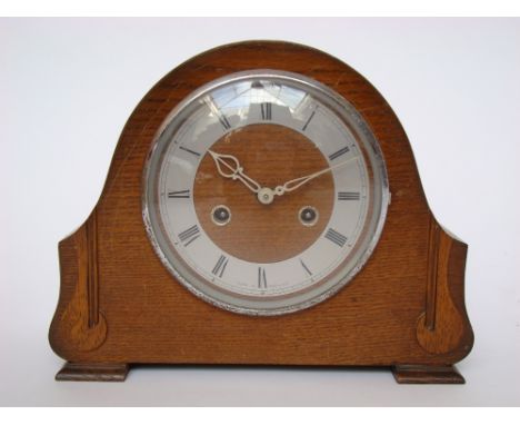 A Smiths oak cased striking mantel clock. 