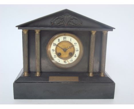A late Victorian architectural slate mantel clock, with striking eight day French Japy Freres movement, retailed by W Bruford