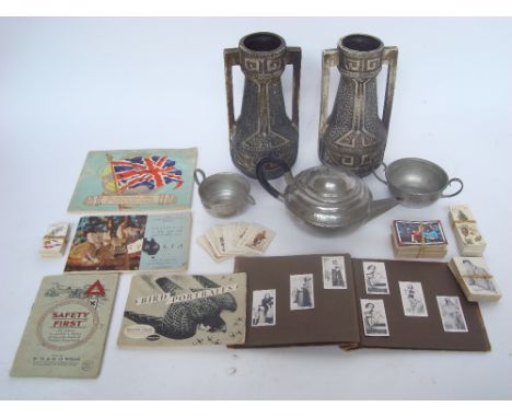 A mixed lot to include a cameo pewter three piece tea service with hammered finish, a pair of Clanta twin handled pottery vas