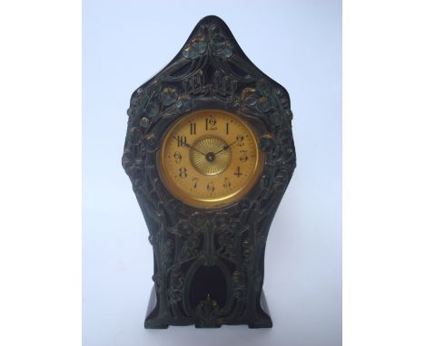 An Edwardian mahogany cased mantle clock, the case with applied pierced gilt metal art nouveau decoration. 