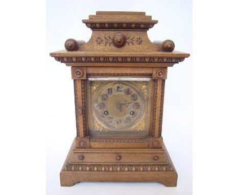 An Edwardian mahogany architectural mantel clock, the square brass dial with silvered chapter ring and Arabic numerals, eight