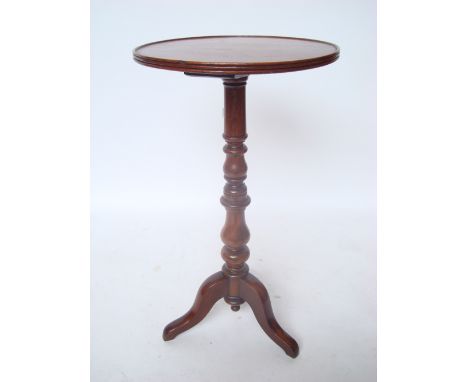 A Victorian mahogany tripod occasional table, the circular top with reeded edge on baluster turned stem and cabriole legs. 
4