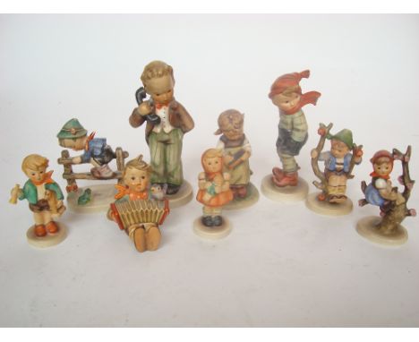 Nine Goebel Hummel figures. 