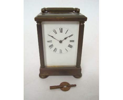 An early 20th Century gilt brass five glass carriage clock, the white enamel dial with Roman numerals, the movement stamped m