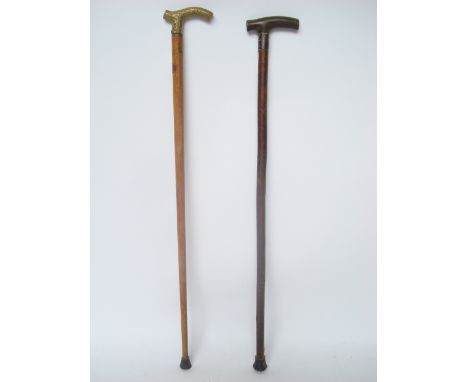 An early 20th Century walking stick, with silver collar and horn handle together with another walking stick (2). 