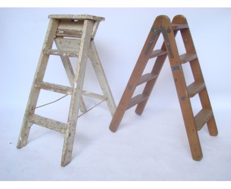 Two wooden folding step ladders. 