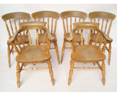 A set of six beech spindle back kitchen chairs including a pair of bow back elbow chairs. 