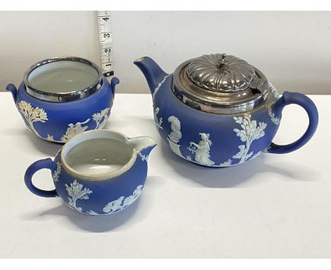 A Wedgwood Jasperware teapot, sugar bowl and milk jug, shipping unavailable
