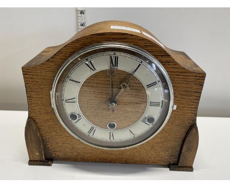 A vintage wooden cased mantle clock with pendulum, shipping unavailable