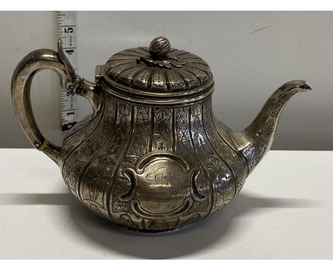 A hallmarked for Dublin 1852 silver teapot 700grams in total weight. (slight damage to handle)