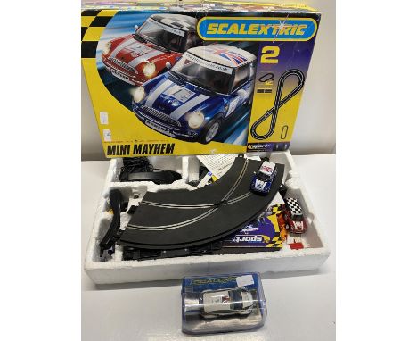 A boxed Scalextric Mini Mayhem set complete with cars and one other Scalextric car model (untested)