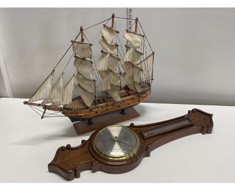 A hand built wooden ship model and barometer, shipping unavailable