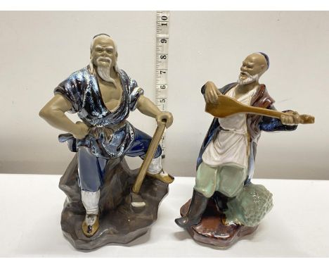 Two ceramic Chinese Mud Men figures tallest 26cm
