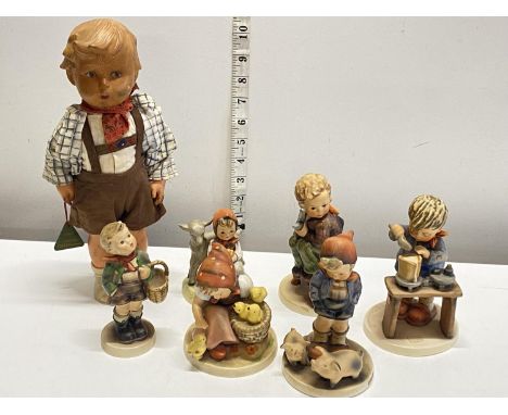 A selection of assorted Hummel, Goebel figurines with a vintage Hummel doll, shipping unavailable