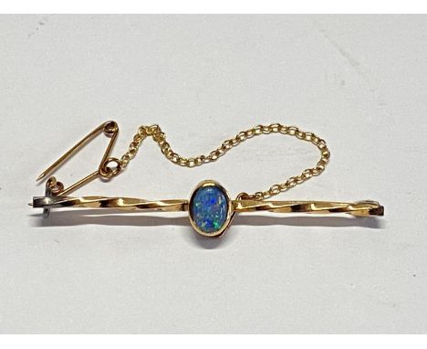 A 9ct gold and Opal bar brooch with safety chain 2.69g
