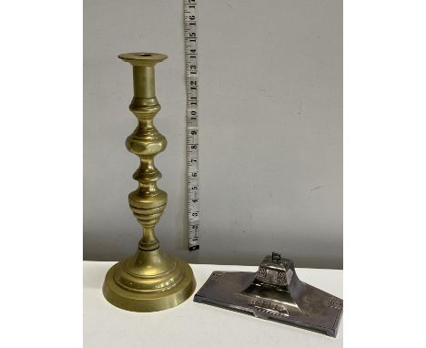 A heavy brass candlestick h35cm and a early 20th century silver plated ink well with original liner marked 120k