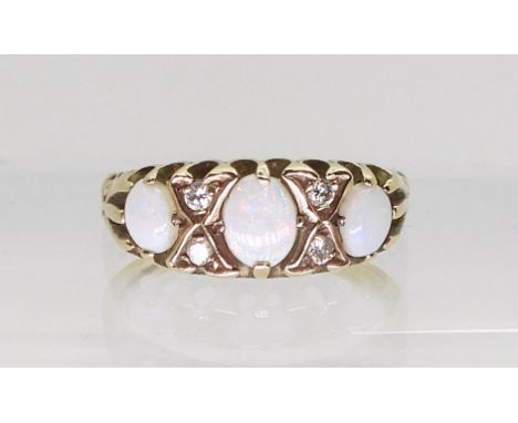 A 9ct gold opal and diamond ring, finger size J1/2, weight 1.6gms Condition Report:Available upon request