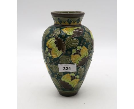 A Burmantofts pottery tube lined vase decorated with flowers Condition Report:Available upon request
