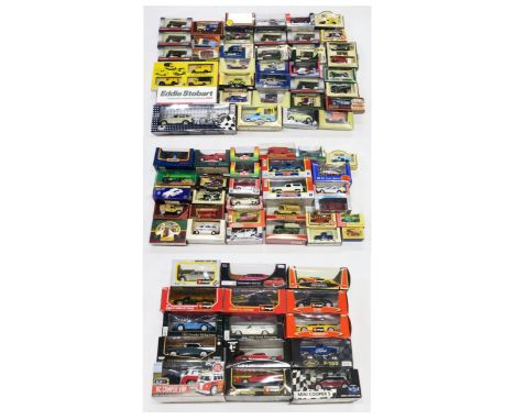 An assortment of packaged 1:24 and 1:25-scale diecast model vehicles, to include Burago (Mercedes-Benz 190E, Ford Street Ka, 