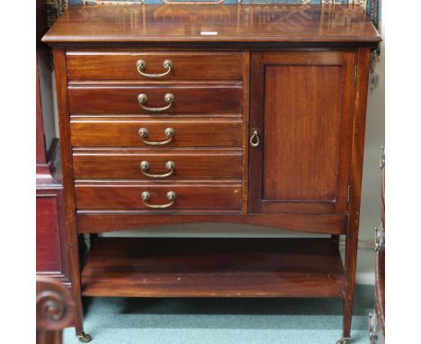 An early 20th century mahogany music cabinet with five drawers with hinged fronts alongside single cabinet door on square tap