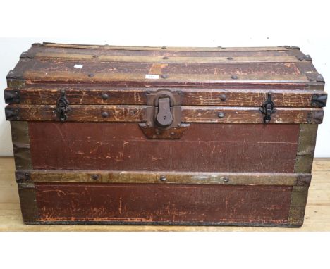 A 20th century wood bound dome top travel trunk Condition Report:Available upon request