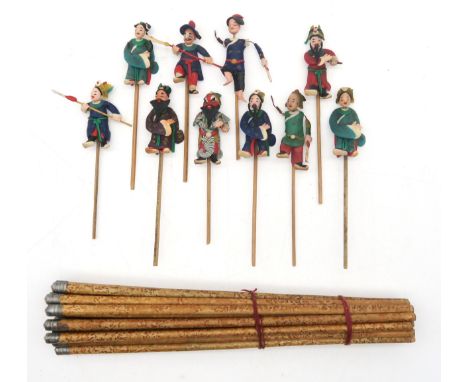 A characterful set of ten Eastern miniature stick puppets; and a suite of metal-mounted chopsticks Condition Report:Available