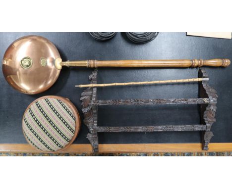 A lot comprising a carved oak wall mounted plate rack, copper and brass bedwarmer, bamboo swagger stick and a tapestry uphols