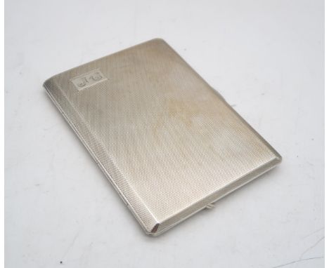 A silver cigarette case, by Walker &amp; Hall, Sheffield 1955, the body with engine turned decoration, monogrammed 'J.G', 155