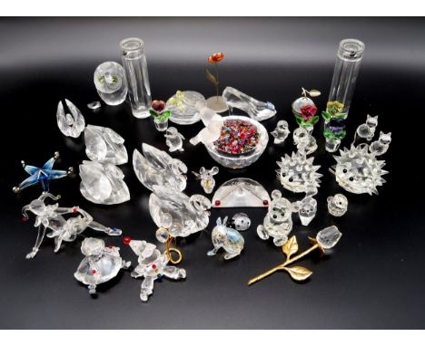 A collection of Swarovski crystal ornaments including animals, birds, doll, puppet etc Condition Report:Available upon reques