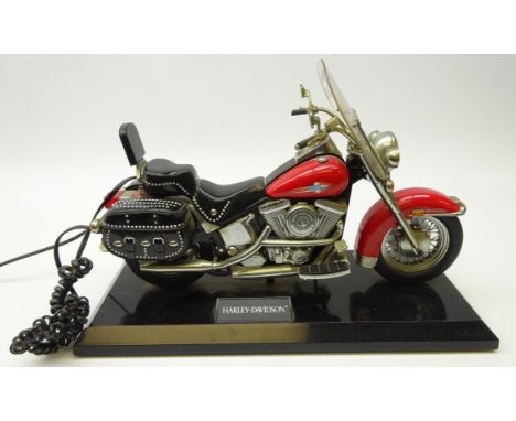 Novelty telephone in the form of a Harley Davidson on stand, L38cm 