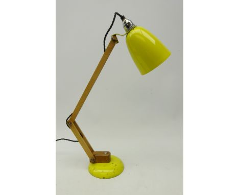 Mid 20th century industrial desk lamp, yellow enamel base and shade with teak adjustable stem, H57cm 