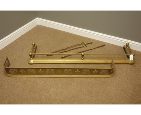 Early 20th century telescopic brass fire fender, another fire fender with pierced decoration and two fireside tools