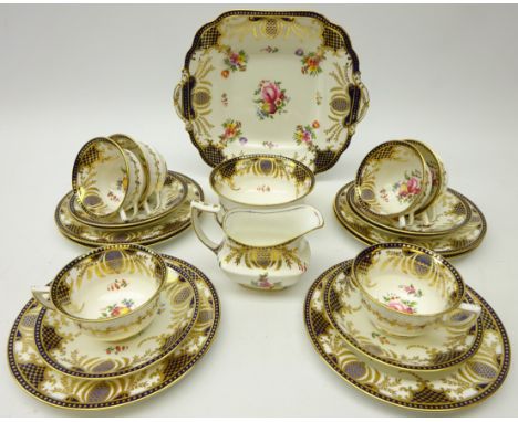 Early 20th century Aynsley tea service for four persons, decorated with floral sprays within a cobalt blue and gilt border (2