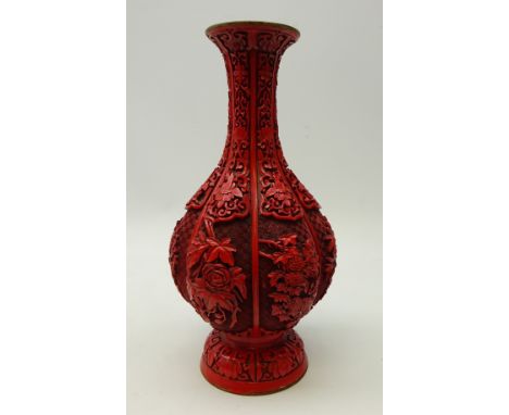 20th century Chinese Cinnabar lacquered vase, of lobed form, carved in high relief with peony, lotus and other flowers on key