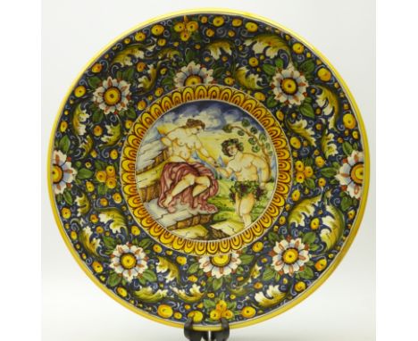 Large 20th century Italian Majolica style charger, the central panel depicting Bacchus and Ariadne, D52cm 