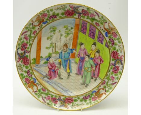 19th century Chinese Famille Verte enamelled plate, the central panel depicting a figure kneeling before a nobleman in ceremo