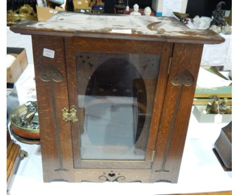 Early twentieth century Art Nouveau style carved oak table top cigar cabinet with central glass panel door, 45 cms high