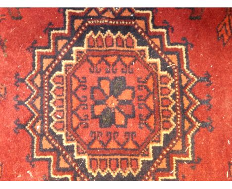 Persian style wool carpet, red ground with hexagonal guls, lozenge border, 205cm x 291cm 