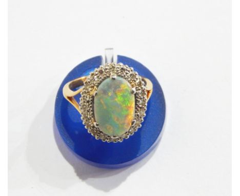 18ct gold, opal, doublet and diamond cluster ring set oval opal surrounded by brilliant cut diamonds 