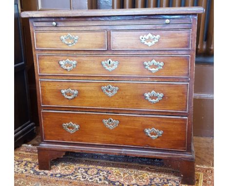 Georgian mahogany bachelor's chest with brushing slide, three long and two short drawers, on bracket feet 