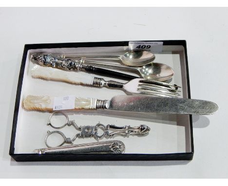 Pair of 18th century Old English sugar nips, mother-of-pearl handled knife and fork, pair silver teaspoons with angular termi
