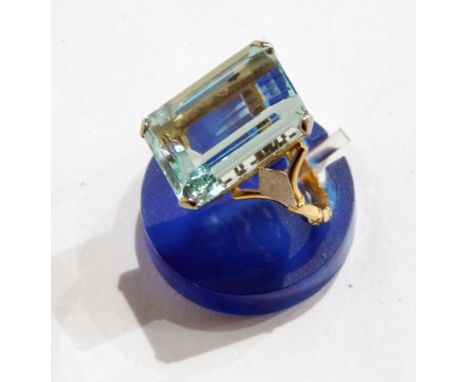 Gold-coloured metal and bluestone ring, possibly aquamarine, having rectangular cut stone with bamboo-pattern shank 