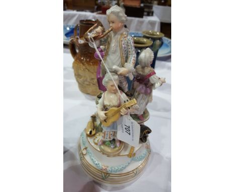 Vienna porcelain figure group of children playing instruments, each in Georgian dress and standing on circular plinths at var