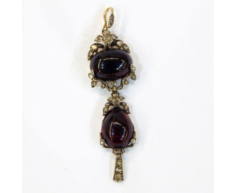 Antique cabochon garnet and diamond pendant, the diamond set loop above oval cabochon garnet surrounded by diamond set scroll