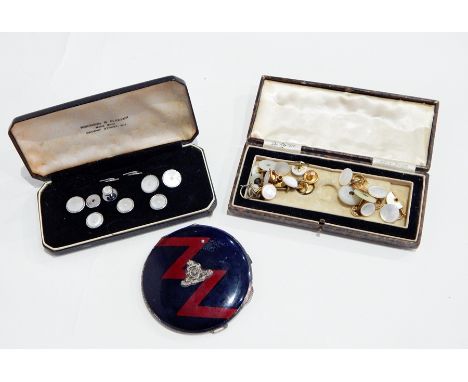 Two sets of mother-of-pearl dress studs, cased together with lady's Royal Artillery compact 